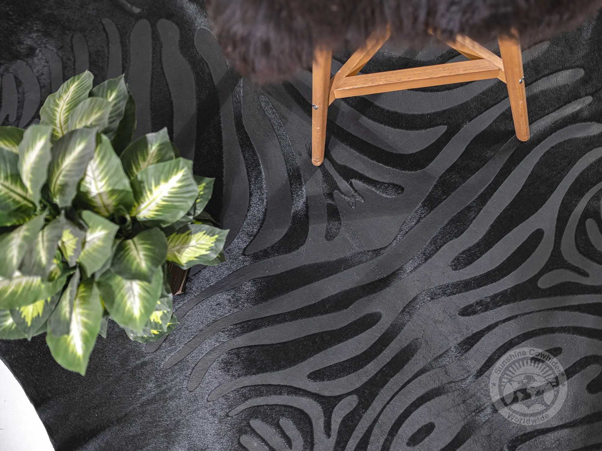 Zebra Acid Wash on Dyed Black Cowhide Rug